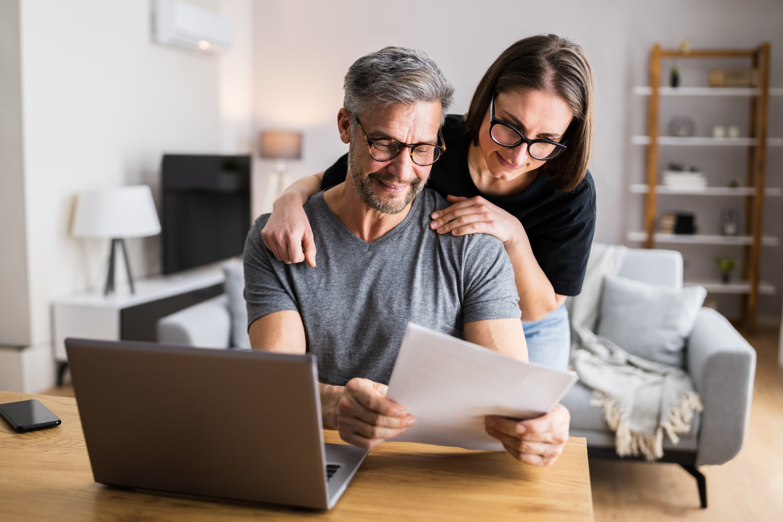 Couple Doing Taxes And Family Budget